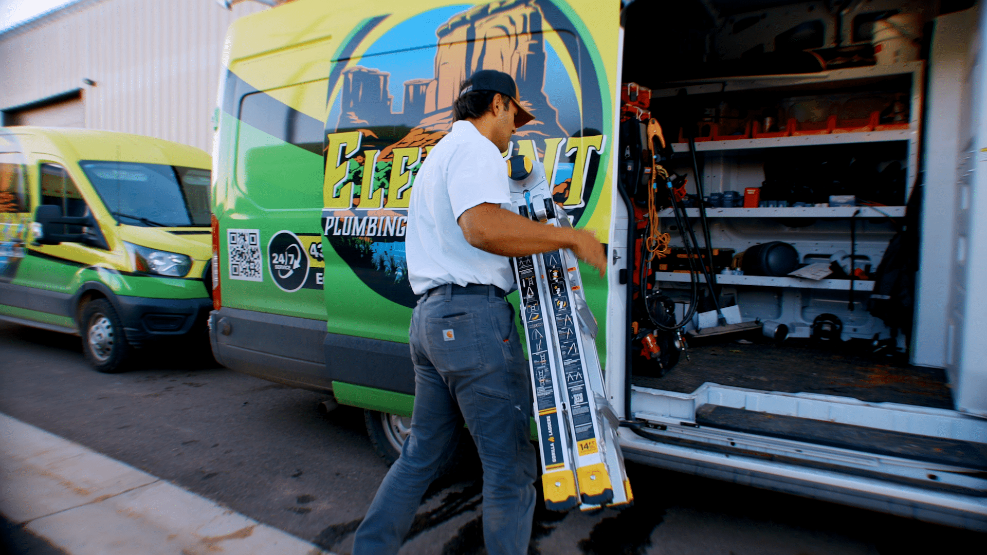 Element plumber putting equipment back in a work truck